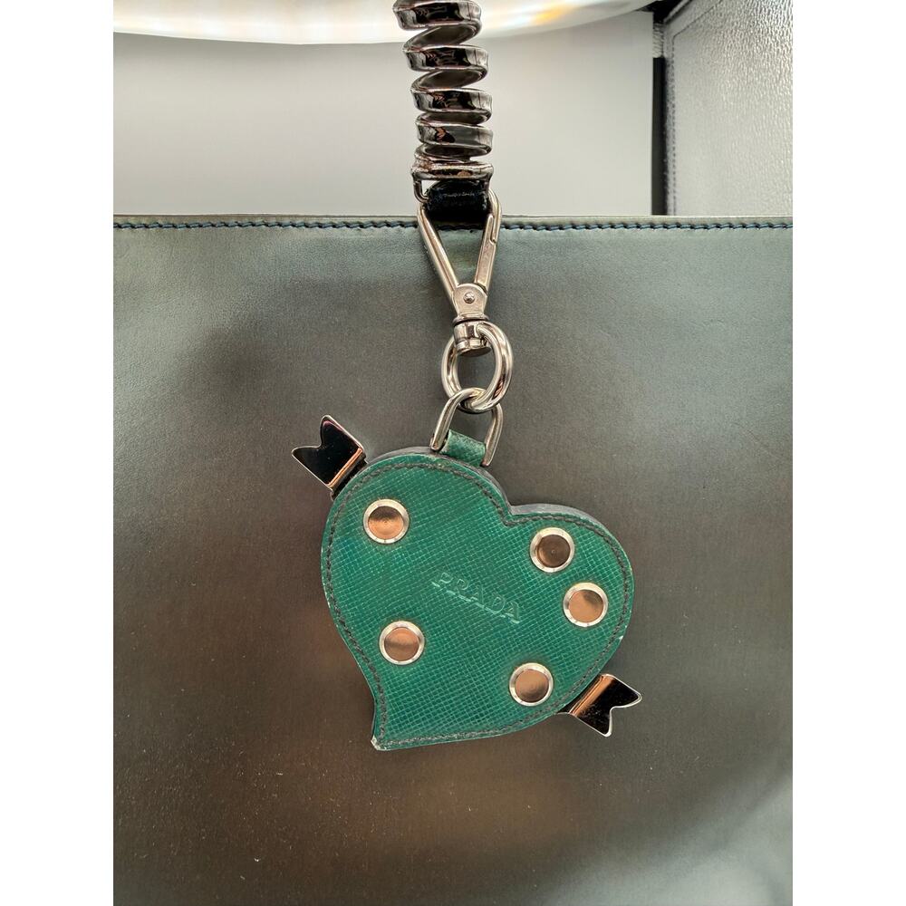Prada studded heart keychain made of green saffiano leather